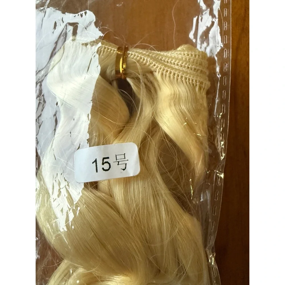 Doll hair wefts. Lot of 13